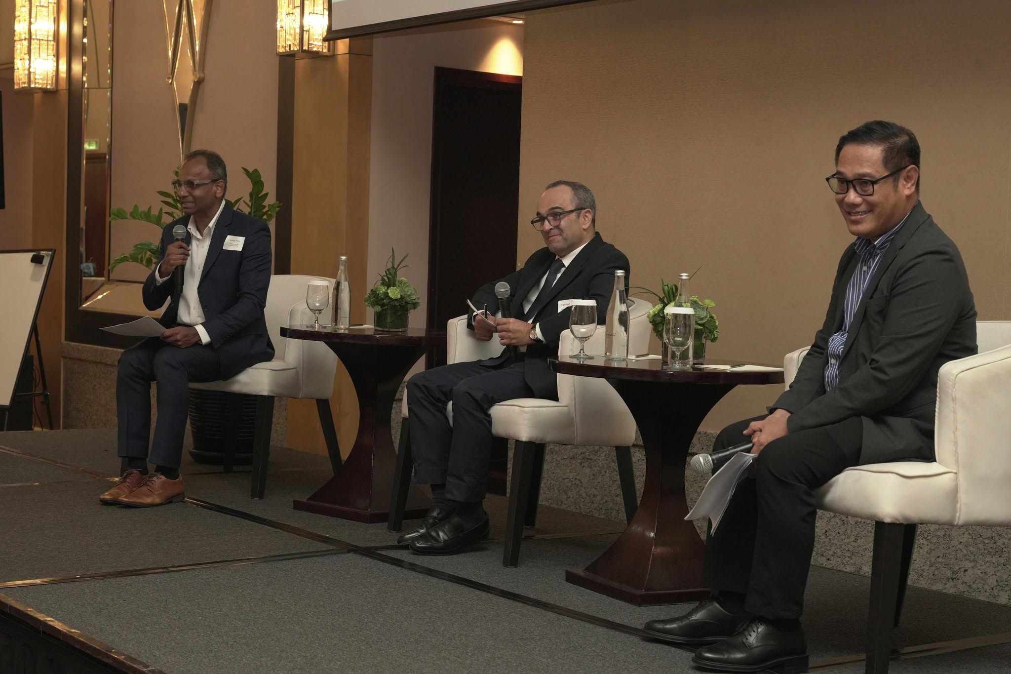 Infrastructure Asia Executive Director Lavan Thiru moderating the fireside chat with Eleazar E. Ricote, Deputy Executive Director of the Public-Private Partnership Center of the Philippines and Farchad Kaviani, Managing Director, Southeast Asia at SUEZ.